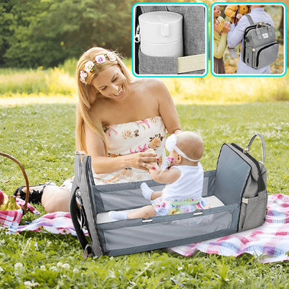 sac a langer lit bebe assis maman heureuse 