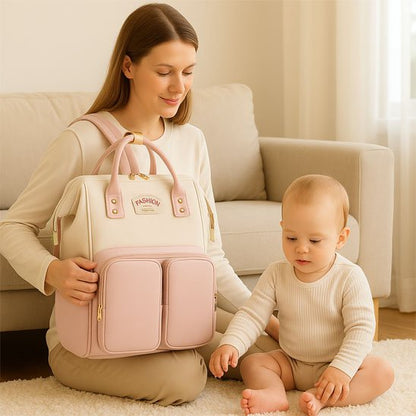 Sac a langer rose blanc bebe assis